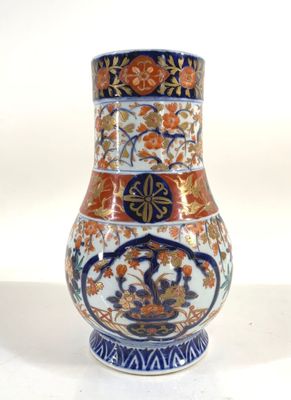an image of a vase with a floral design on it
