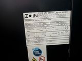 a picture of a black refrigerator with a sign on it