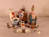 many different vases and bowls sitting on a table