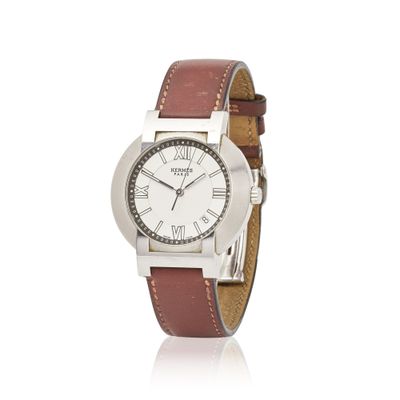 an image of a wrist watch with roman numerals on a brown leather strap