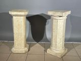 pair of marble pedestals on tiled floor in a room