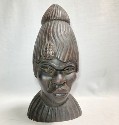 an image of a statue of a woman with a hat on her head