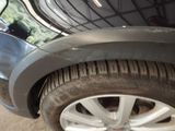 a close up of a car ' s tire on the ground