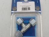 two pieces of metal fittings in a package on a white surface