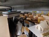 a room full of chairs and a table with a lot of boxes