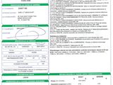 a green and white document with a barcode on it