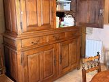 a large wooden cabinet in the middle of a room