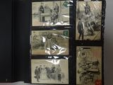 a bunch of old photos on display on a table