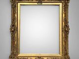 a gold framed mirror with a white background