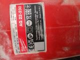 a red fire extinguisor sitting on a table