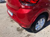 a red car that is parked in a lot