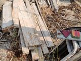 many pieces of wood that are laying on the ground