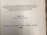 an old book with a black and white title on it sitting on a table