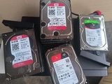 four hard drives stacked on top of each other on a table