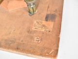 an old book with a pen and inkwell on it