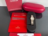 a box with a watch and a case on a table