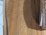 a piece of wood on the table with a piece of paper on it