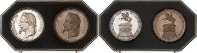 three different types of silver and bronze coins in a display case
