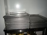 two trays of food sitting on top of a table