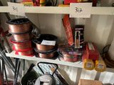 many different types of wires on the shelves in the garage