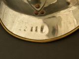 a close up of a silver plate with a clock on it