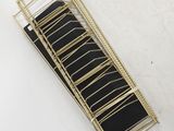 an image of a black and gold stair case on a white surface