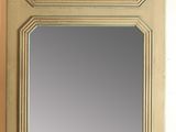 a mirror on the wall with a painting on it