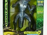 the godzilla action figure is in the box on the table
