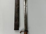 pair of old knives on a white surface with a knife in the middle