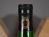 a bottle of wine that is sitting on a table