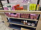 a display of cosmetics products on a shelf in a store