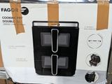 packaging of a black and white microwave sitting on top of a cardboard box