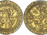 a gold coin with a cross on the front and a cross on the back