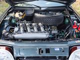a car with its hood open with the engine in the trunk