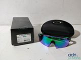 sunglasses and case are sitting on a table next to a box