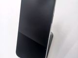 a cell phone that is sitting on top of a stand