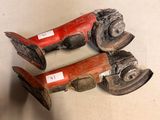 two pairs of old wooden shoes are sitting on a table