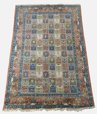 an antique persian rug with a multicolored design