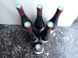 four bottles of wine are sitting on a counter top