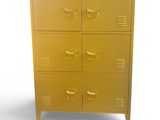 a gold metal cabinet with five drawers and a cup on top