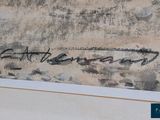 a close up of a painting with writing on it