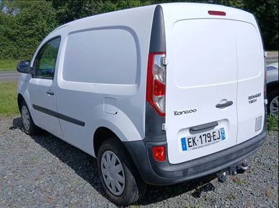 a white van that is parked in the gravel