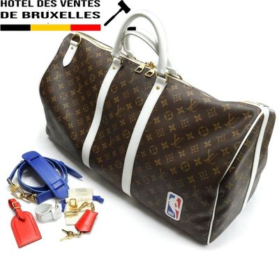 a brown and white louis vuitton bag with keys and luggage