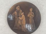 a picture of a picture of three people on a plate