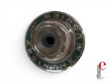 a close up of a metal object on a white surface