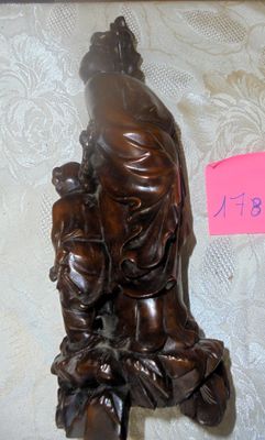 a statue of a woman holding a child on a table