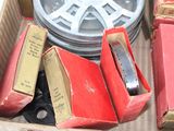a box full of books and a pair of scissors in it