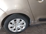 a silver car that is parked in a garage