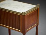 an antique wooden table with a marble top on a wooden stand