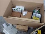 many boxes of electronic equipment sitting on the floor